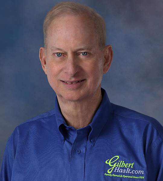 [caption: Gil Culbreth] Gil wearing a blue "GilbertHasIt.com" shirt